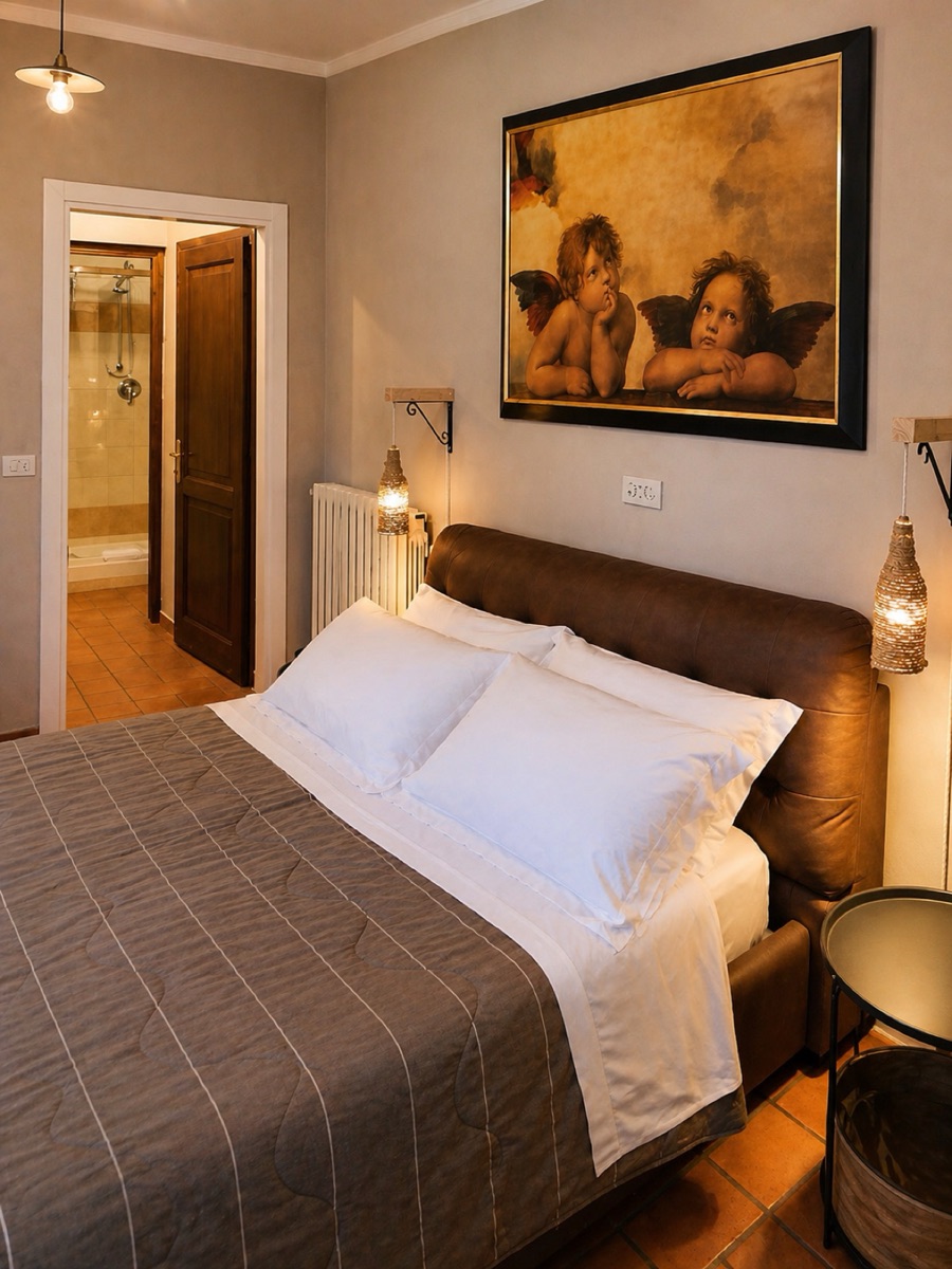 Intimate cropped view of bed and cherubs